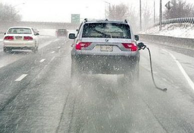 Car Driving With Gas Hose