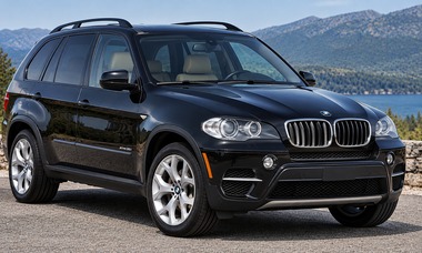 2012 BMW X5 xDrive35i second-generation SUV in dark graphite, front three-quarter view